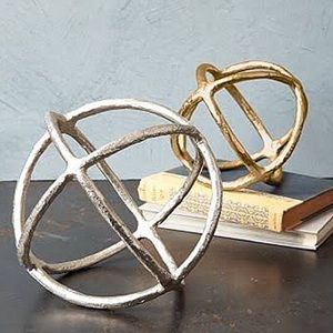 One large and one small silver decorative sphere