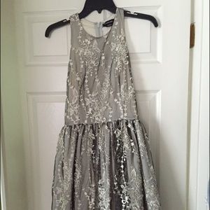 Size small silver Bebe dress only warn once