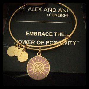 shiny gold spiral sun bangle