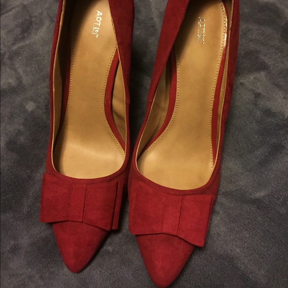 Red suede heels with bows