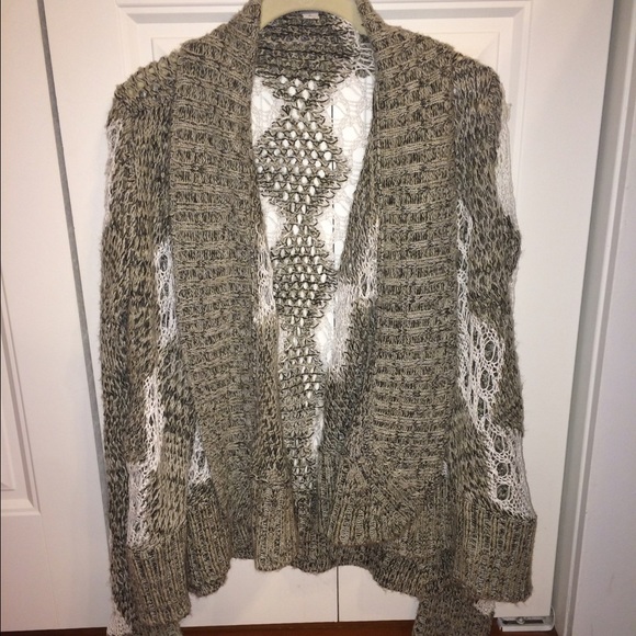Poof cozy, distressed sweater