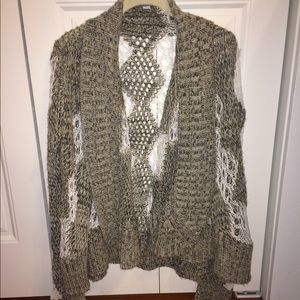 Poof cozy, distressed sweater