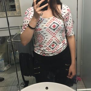 Black, white and red shirt.
