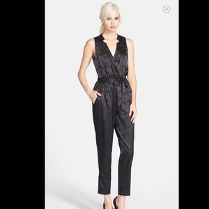 Silky black Astr jumpsuit with collar details.