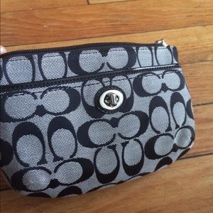 Small black and grey coach wristlet
