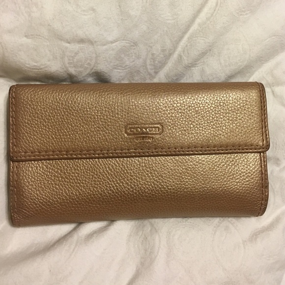 Authentic Coach iridescent gold leather wallet.
