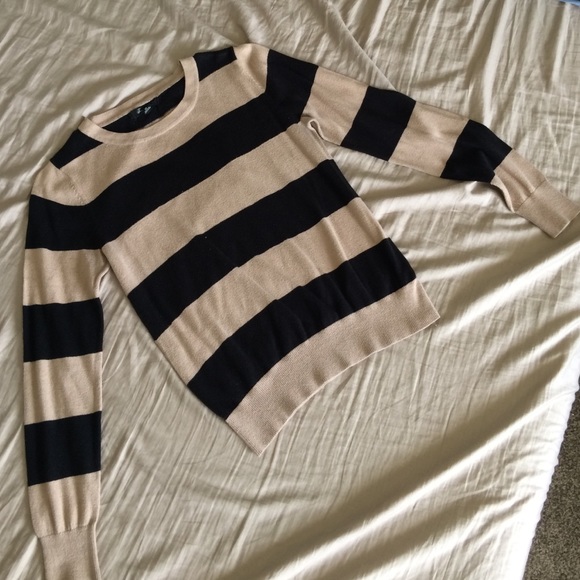 Tan and black pull over sweater/shirt