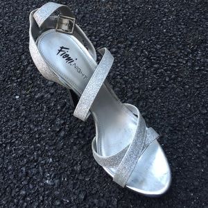 Silver sparkled high heels.