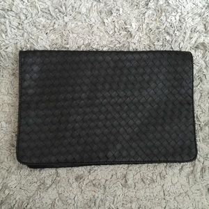 Oversized woven clutch.