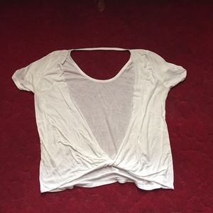 Open-backed white t-shirt.