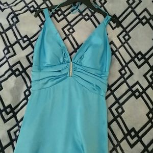 A long turquoise dress.