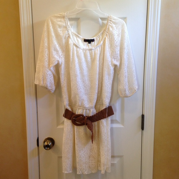 Lacy white dress with brown belt