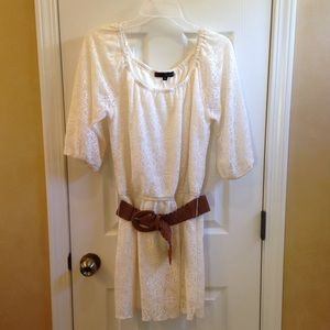 Lacy white dress with brown belt