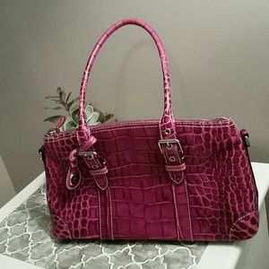 Magenta Dooney and Bourke crocodile handbag.