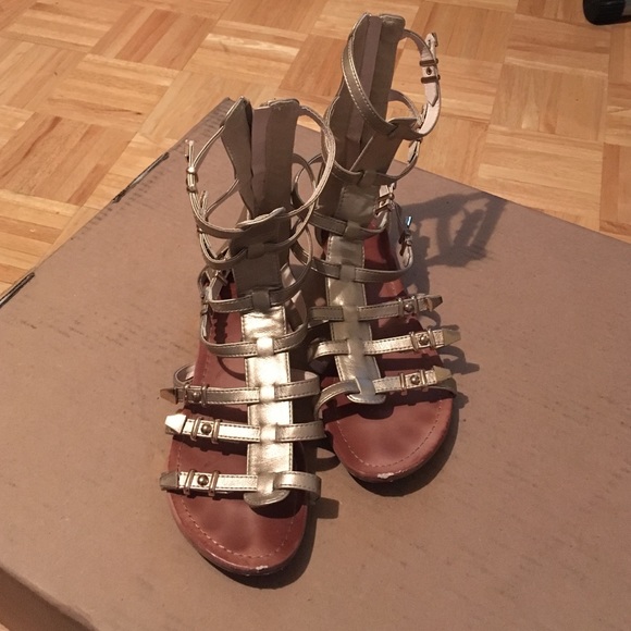 Used gold metallic gladiator sandals