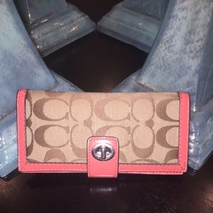 Brown and peach coach wallet.