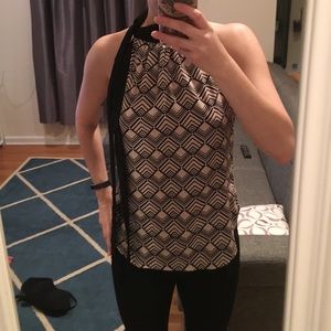 Geometric satin blouse with long tied at neck.