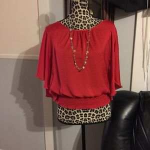 Red silk blouse