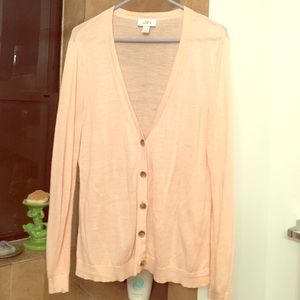Light pink, gauzy, summery button front cardigan.