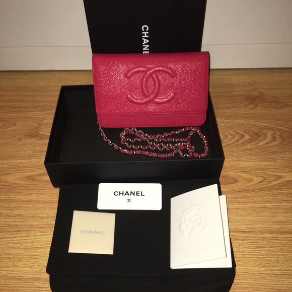 Chanel dark pink caviar wallet on chain .