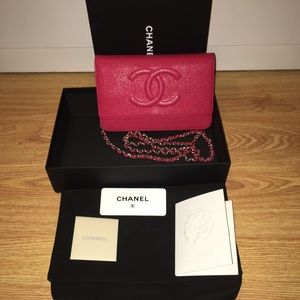 Chanel dark pink caviar wallet on chain .