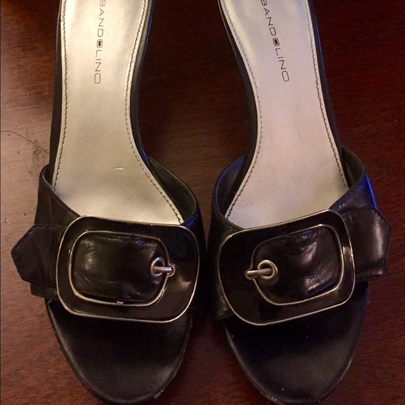 Bandolino black heels with large buckle.