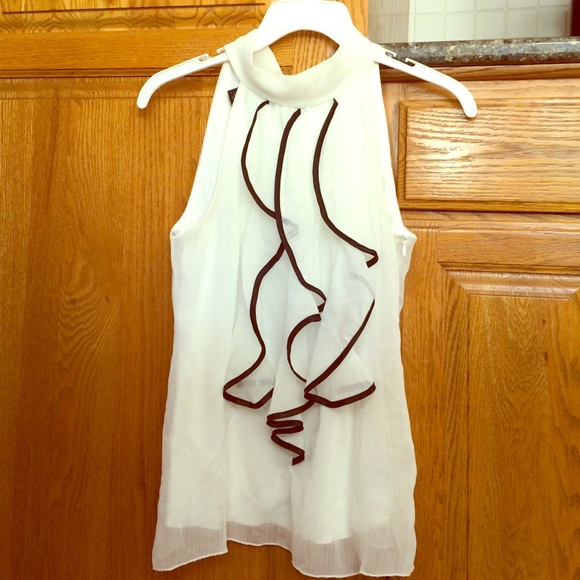 White ruffled sleeveless work top