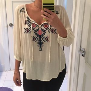 white blouse with aztec design