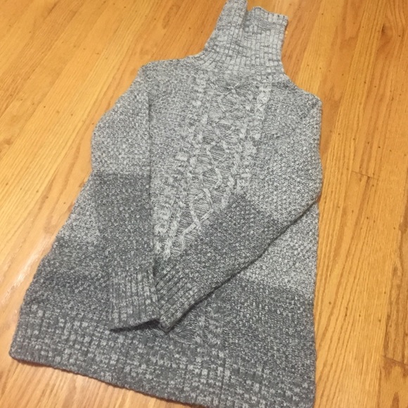 Grey turtle neck sweater.