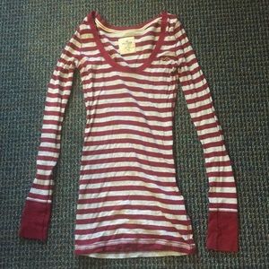 Red and white striped, long sleeve shirt.