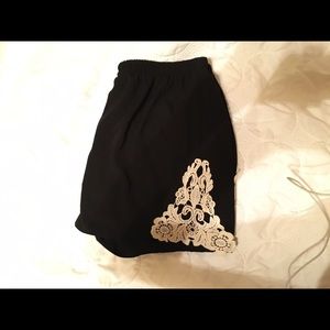 Black high rise polyester shorts with lace
