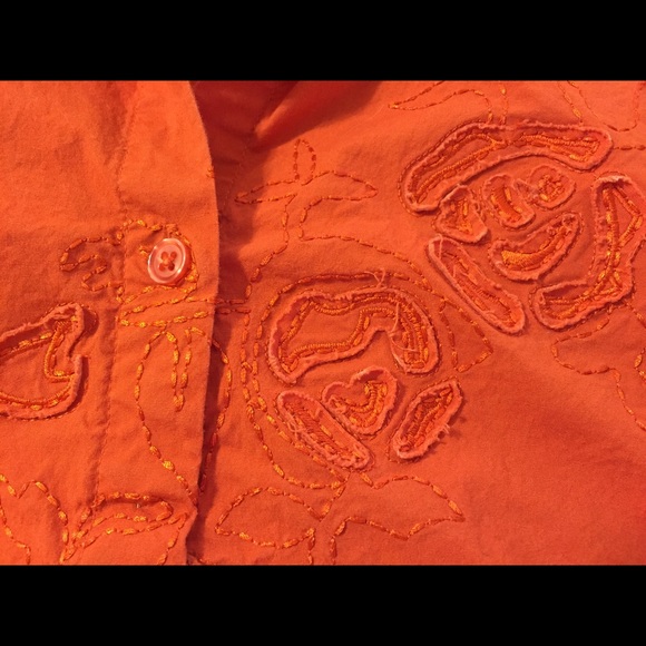 Orange blouse with appliqué detail
