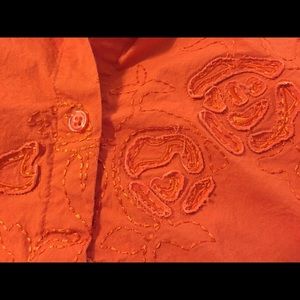 Orange blouse with appliqué detail