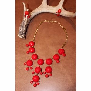 Red statement necklace and earrings