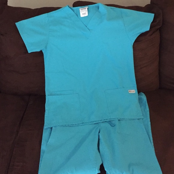 UA Scrubs. Top is small and bottoms are Xs
