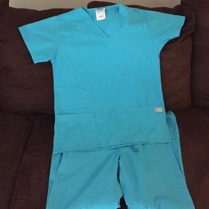 UA Scrubs. Top is small and bottoms are Xs