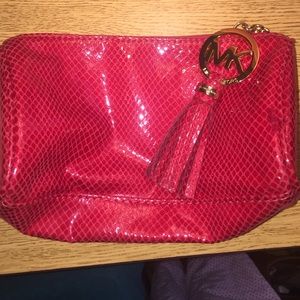 Red Michael Kors makeup bag