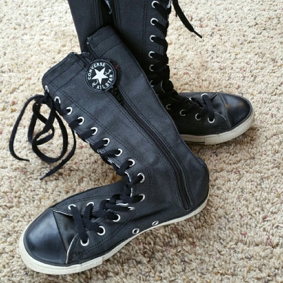 Knee high converse laces CONVERSE ALL STAR zip and lace up knee high shoe boots. Boots are approximately 15 inches tall. Boots are used but show very minimal signs of wear. Size 6 womens/4 mens.