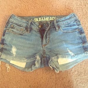 Low rise distressed denim shorts