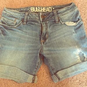 Midi low rise distressed light denim shorts