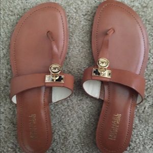 Never been worn Michael kors flip flops! Size 8.