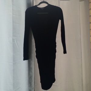 Low V black bodycon dress.
