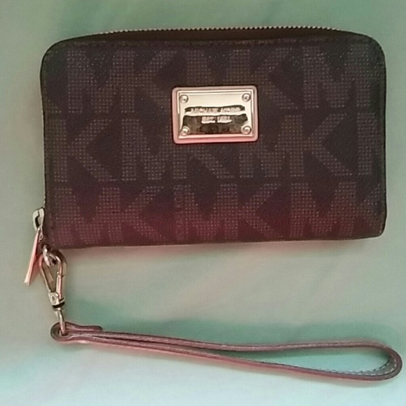 Signature mk wristlet.