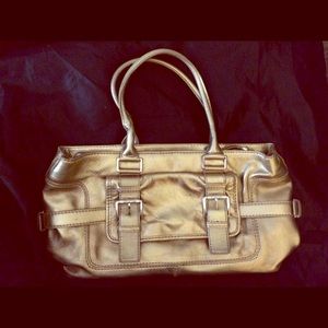 Authentic Micheal Kors gold handbag.