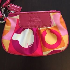 Brightly colored Coach wristlet