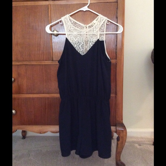 Navy blue romper with cream lace at top