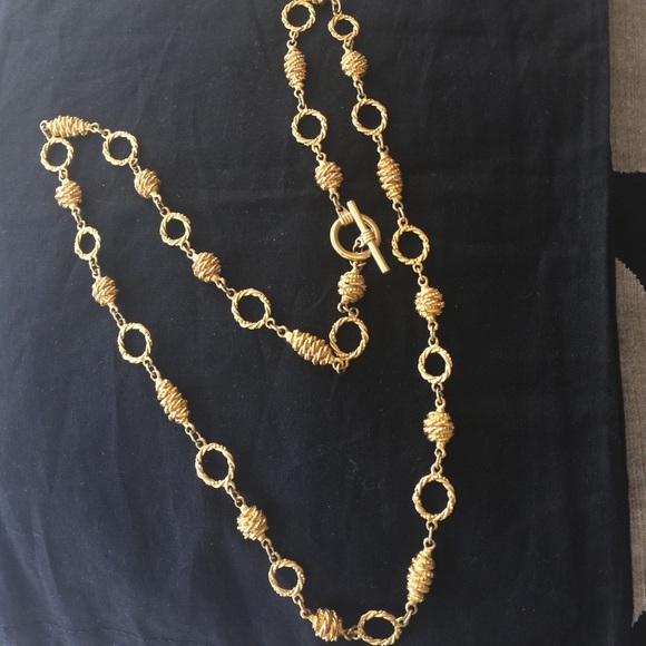 Decorative, long gold Color necklace.