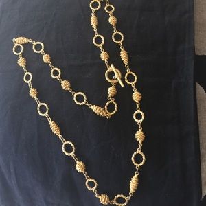 Decorative, long gold Color necklace.