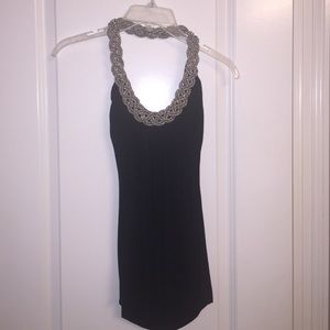 Black halter shirt with silver chain around neck