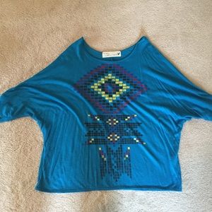 Teal flowy shirt with Aztec design on front